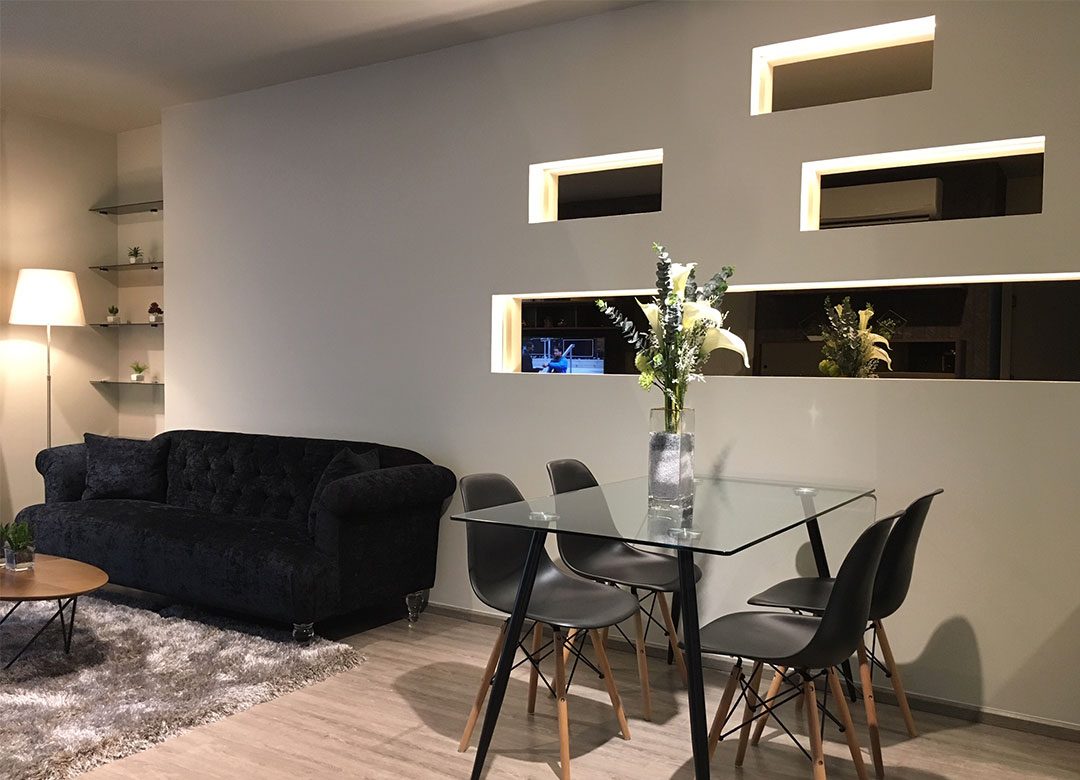 Feature bespoke wall with gold mirrors | Linear design at The Rhythm Ekkamai | Bangkok